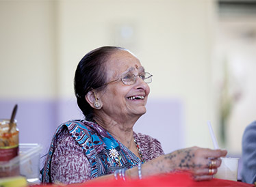 Woman in a saree laughing